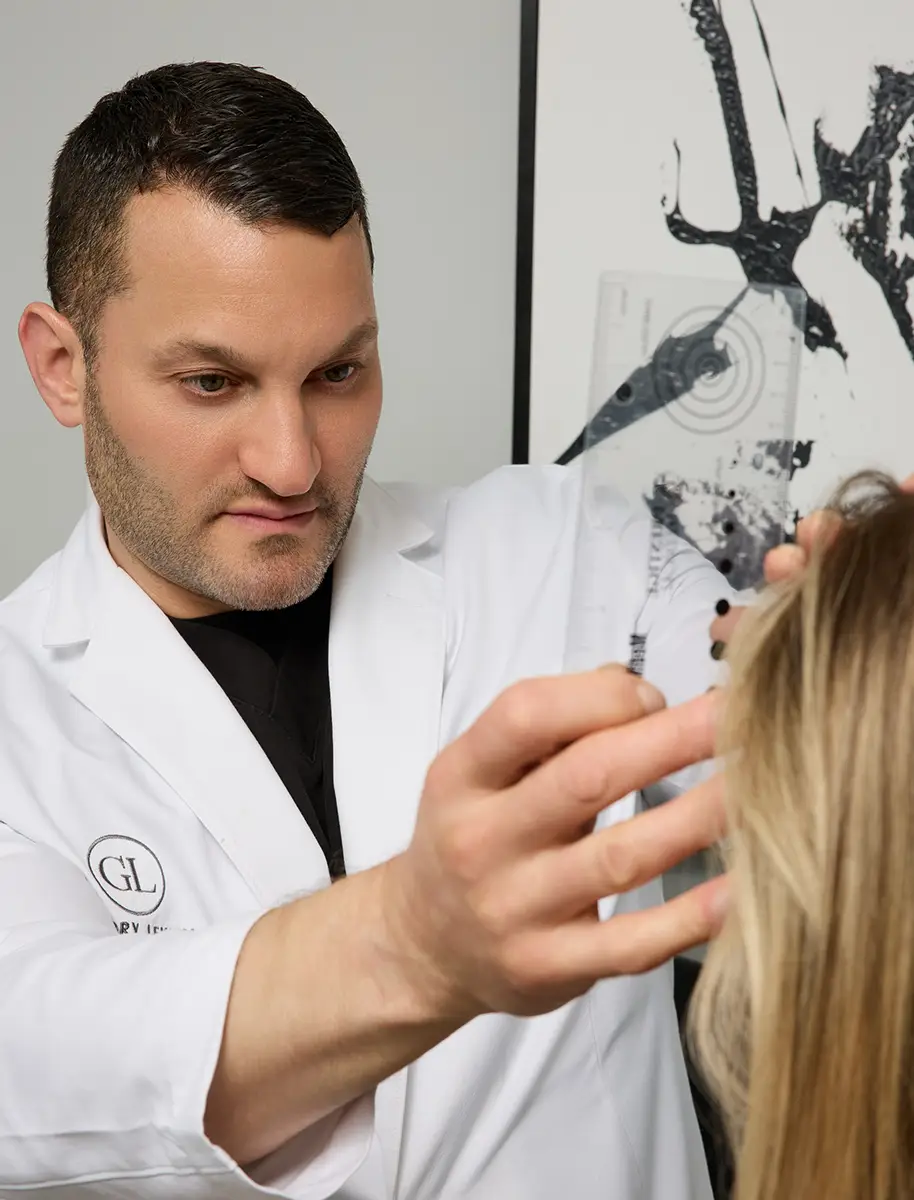 Dr. Gregory Lewen with patient