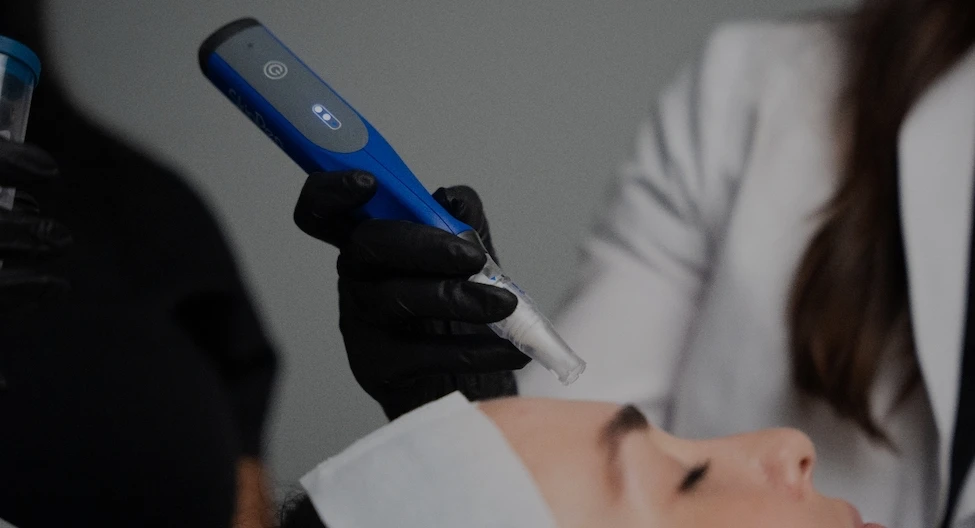 skin rejuvenation device working on someones face | Top Miami Surgeon Gregory D. Lewen, MD