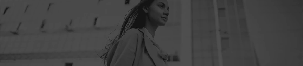 woman in the city walking in black and white | Top Miami Surgeon Gregory D. Lewen, MD